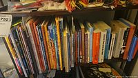 Photo of children's story and folktale books on a shelf showcasing colorful spines and titles.