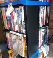 Photo showing DVDs including The Wind in the Willows boxed set, various Blu-rays and DVDs including Disney's Monsters, Inc., The Incredibles, Despicable Me, anime Blu-rays and others.