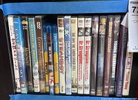 Shelf with DVDs including Studio Ghibli films Castle in the Sky, Mononoke, Ponyo, and more, plus Mel Brooks films and sci-fi.