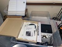 Photo of LG N2B1 NAS device and original packaging including quick installation guide and manual.