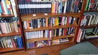 Overall view of multiple shelves filled with books