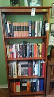 Full bookshelf showing multiple volumes of military history and politics books