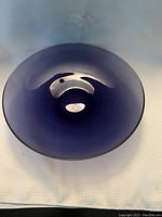 Top view of the purple glass bowl showing its translucent deep purple color and smooth finish.