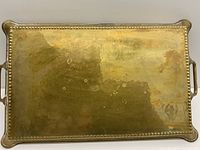 Angled top view showing full tray surface, bead border and handles