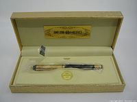 HERO 200B fountain pen in original gold-tone textured box with cream lining and HERO logo plate.