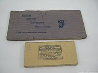 Photo showing the closed watercolor booklet and the closed box of Reeves Terrachrome Crayons