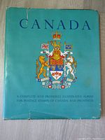 Blue cover album titled 'Canada' with royal crest
