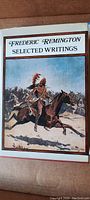Cover of the Frederic Remington Selected Writings book showing Native American on horseback illustration