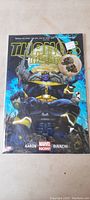 Photo showing full front cover of the comic book Thanos Rising with Thanos character prominently displayed and price sticker visible.