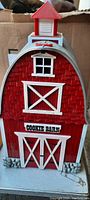 Front view of the vintage cookie barn container showing detailed barn design and 'COOKIE BARN' sign