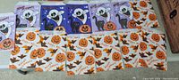 Image showing first set of vintage Halloween candy bags with ghost, skeleton, black cat, and pumpkin designs in various colors