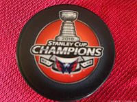Close-up image of 2018 Stanley Cup Champions Washington Capitals hockey puck, logo and text visible