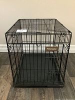 Front angled view showing the crate's door, latch, and Petmate brand label.