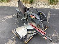 Full view of the Craftsman mitre saw showing the main body, blade, and base with angle adjustment scales.