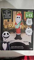 Box showing product image with Jack Skellington holding a toy, 5.5 ft tall, energy efficient LED lighting
