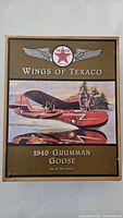 Front of the box showing the Texaco Wings branding and an illustrated 1940 Grumman Goose seaplane on water.