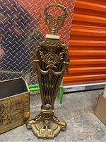 Full view of the ornate brass bed warmer showing handle and body design