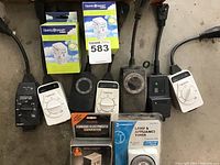Overview photo of several timers and converters laid out on floor