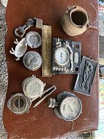 Overview of kettle pot, gauges, nameplate, timer and small decorative trays on tabletop