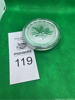 Maple leaf side of coin showing purity inscription ".9999 FINE SILVER 10 OUNCES"