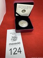 2013 Canadian silver coin in a red presentation box with information card visible in the lid.