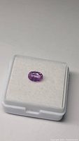 Oval pink sapphire in display box