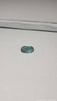 Oval cut 4.13ct gemstone combining deep blue aquamarine and yellow heliodor beryl.