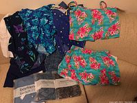 Full layout showing multiple women's swimwear and coverups, including floral and solid color garments and packaged items.