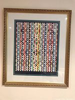 Full view of framed print showing composition, mats, frame and plexiglass surface