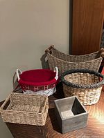 Photo of five assorted baskets showing variations in shape, size, and materials, including a Christmas-themed basket with fabric liner.