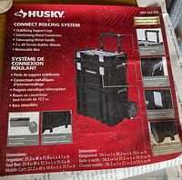 Product packaging label showing Husky Connect Rolling System features, model number and module dimensions