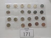 Full set of 22 Canadian quarters displayed in plastic coin holders arranged in rows.