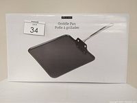 Photo showing the box of the Epicure 11" square griddle pan with a picture of the pan on the front.