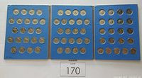 Three blue album pages showing Canadian nickels from 1967 arranged in rows with clear visibility of coin faces and Centennial designs.