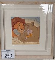 Framed serigraph art showing Mufasa, Sarabi, and Simba cuddling with white mat and light wood frame.