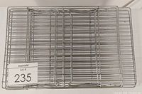 Two low profile cooling racks stacked, grid wire metal surface, 16 1/2 x 10 1/8 inches