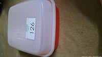 Tupperware marinate container fully assembled with lid on top.