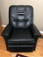 Full front view of recliner showing overall shape and condition