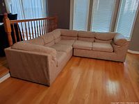 Full front view of the beige L-shaped sectional couch