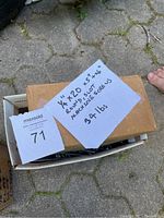 Photo showing box labeled with screw specifications: 1/4x20 x 5" + x6, round slot, approximately 34 lbs.