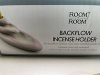 Photo of the Room2Room branded box showing product name and description.