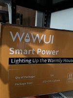 Close up of the Wawui Smart Power branded orange box showing product details and package dimensions.