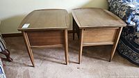 Pair of Deilcraft wooden side tables showing front and side profile with scratches and wear.