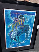 Framed original painting showing a stylized horse in multiple shades of blue with white decorative details, framed in black with double matting.