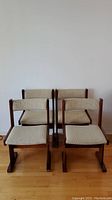 Front view of four chairs in set