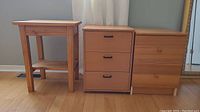 Photo showing all three pieces of wooden side tables together: small 2-tier table with lower shelf, 3-drawer side table, and 2-drawer chest style table.