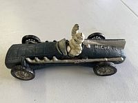 Top-down view of the 1934 Hubley cast iron race car showing Michelin Man figure and Michelin branding on the hood.