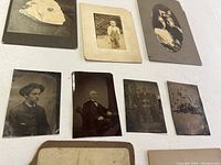 Detailed view of six tin type photographs showing subjects including men and children in various poses on a white background.