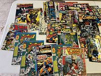 Overview of roughly 30 comics laid out including X-Men, Quasar, Death’s Head II, Terminator Midnite Sons, Batman vs. Predator and a Marvel Comics anthology.