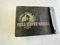 Black vinyl cover with gold text reading “Boeing Model B-17G Field Service Manual Restricted”